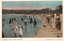 This coloured card shows a crowded beach with people bathing and walking along the shoreline: On the card is printed “Balmoral Beach, Middle Harbour. [Star Photo. Co., Copyright.”