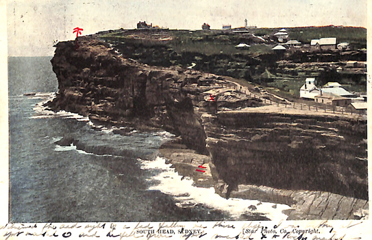 1405.206 This coloured card shows a rocky coastal headland with buildings above the cliffs: On the card is printed “SOUTH HEAD, SYDNEY. [Star Photo. Co., Copyright.” The handwriting is hardly readable but mentions someone has fallen off the cliffs. There are spots marked on the map of where they fell and landed.