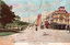 This coloured card shows a broad city street beside a park, lined with buildings, pedestrians and motor vehicles: On the card is printed “ELIZABETH STREET, SYDNEY.”