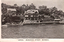 This black-and-white card shows waterfront houses built among rocky slopes: On the card is printed “my abode” and “"GENOA,” MUSGRAVE STREET, MOSMAN.”
