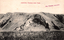 This black-and-white card shows an exposed rock formation on a hillside: On the card is printed “Anticline, Taemas near Yass. WILL THOMSON, PUBLISHER.”