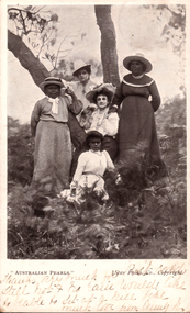 This black-and-white card shows five women and girls posed outdoors among trees: On the card is printed ““AUSTRALIAN PEARLS.” [Star Photo. Co., Copyright.]” The handwriting appears to read: “Thanks very much for Post Card. Still hot & no rain. Would like to be able to sit at a nice place. Much love from Aunty B.”
