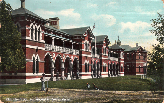 This coloured card shows a large brick hospital building with arched verandahs: On the card is printed “The Hospital, Toowoomba, Queensland”.