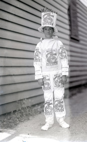 Child in clothing with Kentish Flour bags sewn and hat with wheat on its top