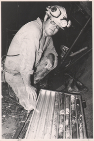 Photograph - AUSTIN COLLECTION: Miner with core samples, Not dated but possibly 1980's