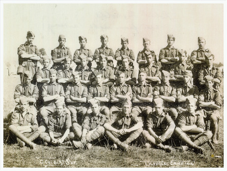 Photo of Robert Reynolds, 3rd from left seated; and 31 other uniformed soldiers of 51st Infrantry at Lilydale Victoria, camp 1914