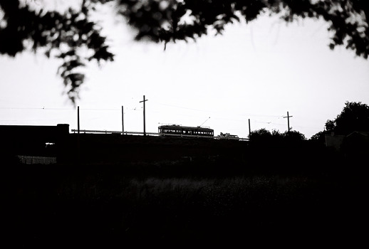 11147.1i Tram crossing the railway at Jobs Gully, on its way to Eaglehawk