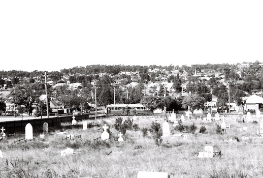 11147.6i The Quarry Hill tram passes the Carpenter and Houston St intersection at the corner of the cemetery