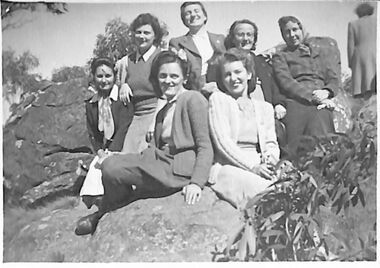 Photograph - Photograph of seven women at Mount Macedon seated on boulder, 25.04.1945