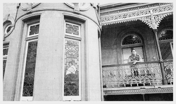 Black and White Photo of one of the tour guides - Lance Cpl Richard Arman on the balcony