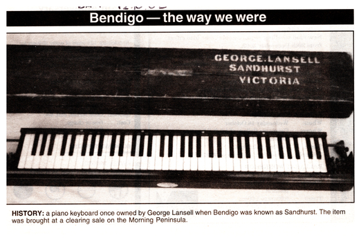 Black and White  photo of a piano keyboard with engraving on the top