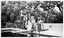 Black and white photo of Family and guests as they celebrate the birthday of Glenice Hudson, daughter of Sir George Lansell's housekeeper at Denderah (View Street) in the mid 1950s