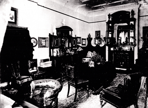 Black and White photo of a living room with chairs and small table