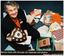 8672.31b Newspaper (Unknown) Article coloured photo of Norma Cook sifting through old clippings and photos, story by Nicole Strahn and photo by Laura Scott.