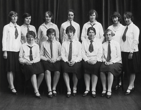 Newspaper article from the Bendigo Advertiser, Mon Nov 04 1985. Family fun Fair in 79th Year, Black and white photo of YWCA Women in the 1920s, by Susan Masters. Front Row: Phyllis Ellery, Leah Wilson, Vi Clifton, Rene Truscott, Hilda Read and Vera Baker. Back Row: Glad Richardson, Elsie Talbot, Dorothy Ackland, Dorothy Hodden and Dorothy McKay