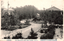 This black-and-white card shows a landscaped school garden with paths, trees and buildings: On the card is printed “（店眞寫川正） THE KASHIWAZAKI MIGER GIRLS' SCHOOL, NIIGATA. The Japanese is printed in the older right-to-left direction:
新潟縣立柏崎高等女學校前庭 — “Front garden of Niigata Prefectural Kashiwazaki Higher Girls’ School.”
正川寫眞店 — “Masakawa Photographic Shop.”