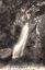 This black-and-white card shows a waterfall descending through a wooded rocky gorge: On the card is printed Chigo-Otosbino-Taki, (Water-Fall) Unzen.” The Japanese is printed in the older right-to-left direction. Read normally, 雲仙嶽稚兒落の瀧 translates as “Chigo-otoshi Waterfall, Mount Unzen.”