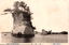 This black-and-white card shows a tall rocky islet topped with pine trees, with a sailing boat and smaller islands in the distance. On the card is printed “View of Matsushima”. The Japanese is printed from right to left and reads:（松島百景）大掛島」 — “Ōgake Island (One Hundred Views of Matsushima).”