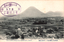 11731.082 This black-and-white card shows a town and fields with a mountain in the background. On the card is printed “View of Mt. Kofuji from Kotohiracho, Sanuki.” The Japanese is printed from right to left and reads 讃岐金刀比羅市街ヨリ小富士遠望, translating as “Distant view of Mount Kofuji from the town of Kotohira, Sanuki.” The Japanese stamp is read mainly from right to left:
参拝記念 — “Commemoration of a visit to the shrine”
金刀比羅宮 — “Kotohira-gū Shrine” or “Konpira Shrine”
The central 金 is the first character of the shrine’s name.
5.7.8 is a date: year 5, seventh month, eighth day; the era name is not shown.