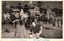 This black-and-white card shows Japanese samurai at a castle, with one man standing in the foreground while others approach on horseback and on foot. On the card is printed “To Deliver'up Akaho-casle” The Japanese caption is printed right-to-left. Read in modern order, it is: 赤穂城明渡し大石良雄の苦心 English translation: “Ōishi Yoshio’s difficulties in surrendering Akō Castle.”