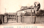 This black-and-white card shows the entrance and buildings of a government department, with an inset portrait of a uniformed man. On the card is printed “THE FINANCE DEPARTMENT.” The Japanese is printed right-to-left. Read in modern order, it is:（帝都十省）桂大藏大臣　大藏省 English translation: “(Ten Ministries of the Imperial Capital) Finance Minister Katsura — Ministry of Finance.” 大藏省 — “Ministry of Finance” 桂大藏大臣 — “Finance Minister Katsura” 帝都十省 — “Ten Ministries of the Imperial Capital”