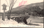 This black-and-white card shows a snow-covered bridge over water with a wooded hillside beyond. On the card is printed “Snow Togetsu-kyo Arashiyama, Kyoto.” The Japanese 京都嵐山渡月橋雪景 translates as “Snow scene of Togetsu Bridge, Arashiyama, Kyoto.”