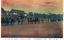 This coloured card shows the Emperor’s horse-drawn carriage and mounted escort leaving a palace precinct. On the card is printed “H. I. M. The Emperor leaving the palace.”, “陛下二重橋御出門” and “（東京名所）”. The Japanese translates as:
陛下二重橋御出門 — “His Majesty leaving through Nijūbashi”
東京名所 — “Famous places of Tokyo” / “Tokyo sights”