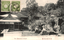 This black-and-white card shows temple buildings and a courtyard with stone lanterns. On the card is printed “The Ishiyama temple” and “近江石山本堂”. The Japanese translates in English as “The main hall of Ishiyama, Ōmi.”
