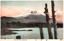 This coloured card shows Mount Fuji beyond a lake, with tree trunks in the foreground. On the card is printed “View of Fuji Mountain.” and “富士山”. The Japanese 富士山 translates as “Mount Fuji.”