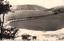This black-and-white card shows a snow-covered coastal landscape with a long narrow sandbar extending across the water. On the card is printed “view of hashidate at tango japan”, “天の橋立” and “（丹後）”. The Japanese translates as:
天の橋立 — “Amanohashidate”
丹後 — “Tango”
Together: “Amanohashidate, Tango.”