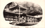 This black-and-white card shows the buildings and lantern-lined approach of Kasuga Shrine. On the card is printed “Kasuga Shrine, Nara.” and “奈良 春日 神社”. Japanese translation:
奈良 — “Nara.”
春日神社 — “Kasuga Shrine.”
Together: “Kasuga Shrine, Nara.”