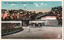 This coloured card shows the Sakuradamon entrance of the Imperial Palace, with stone walls, a bridge, gate buildings, pedestrians and rickshaws. On the card is printed “The Sakuradamon of Imperial Palace.”