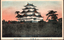 This coloured card shows Nagoya Castle rising above a high stone wall and moat. On the card is printed “NAGOYA-CASTLE.” and “名古屋名所　金城（離宮）”. Japanese translation:
名古屋名所 — “Famous place of Nagoya.”
金城 — “Golden Castle,” a name used for Nagoya Castle.
離宮 — “Detached palace.”
Together, the caption refers to Nagoya Castle as a famous place in Nagoya.
