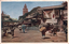 This coloured card shows a street scene in Asakusa Park with pedestrians, flags, and buildings lining the road. On the card is printed “TOKYO. No 12. ASAKUSA PARK” and “浅草公園”. Japanese translation:
浅草公園 — “Asakusa Park.”