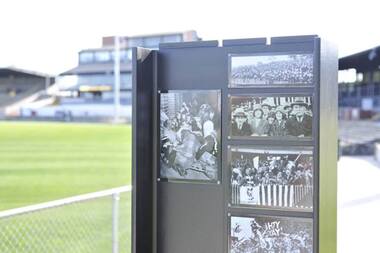 Panel with archival photographs installed at Victoria Park.