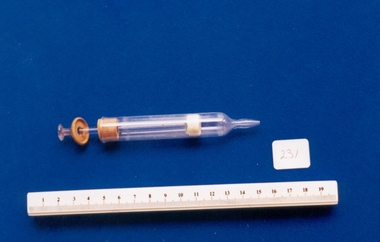Glass aural syringe associated with Dr Geoff Bishop