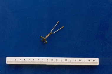 Gold wishbone pessary associated with Dr Cyrus Jones