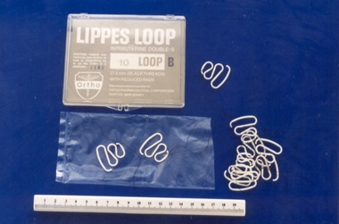 Ten Lippes Loop intrauterine devices, with container, associated with Professor Geoff Bishop, Ortho Pharmaceutical Corporation