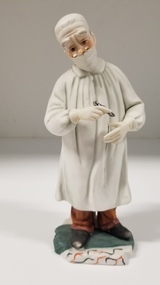 Sculpture - Bisque porcelain figurine of a doctor