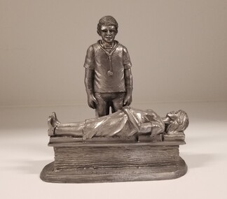 Sculpture - Pewter vignette of an obstetrician observing an antenatal patient, Michael Ricker Pewter