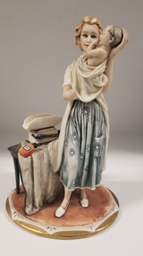 Sculpture - Bellini porcelain figure of a woman holding a baby
