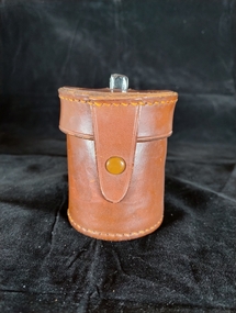 Glass jar containing roll of catgut, with protective case