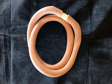 Length of rubber tubing with plastic connector