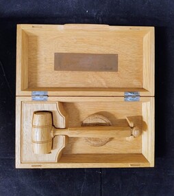 Wooden gavel in case presented to the Royal College of Obstetricians and Gynaecologists Australian Regional Council by Sir Arthur Gemmell, 1954