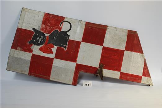 Red and silver checkered object with a cat logo