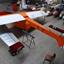 Rear quarter view of Pelican glider in hangar with wing tips and tailplane not fitted.