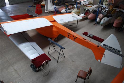 Rear quarter view of Pelican glider in hangar with wing tips and tailplane not fitted.