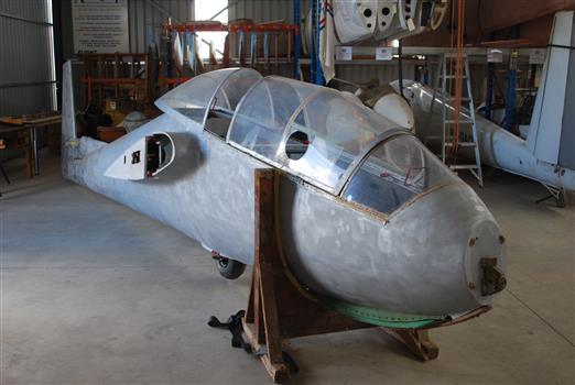 Stripped fuselage on workshop cradle