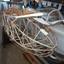 Bare steel tube fuselage frame in storage 