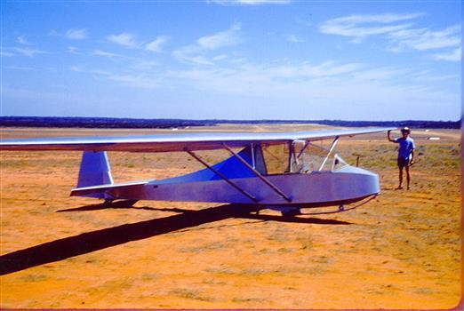 Silver glider in field awaiting launch